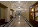 Long hallway with marble floors, paneled walls, and classic lighting fixtures at 350 N Meridian St # 505, Indianapolis, IN 46204