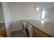 Kitchen bar with a laundry machines featuring granite countertop at 350 N Meridian St # 505, Indianapolis, IN 46204