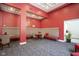 A sophisticated lobby with comfortable seating, patterned carpeting, and red walls at 350 N Meridian St # 505, Indianapolis, IN 46204