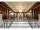 Ornate lobby with coffered ceilings, chandelier, marble floors, and decorative columns at 350 N Meridian St # 505, Indianapolis, IN 46204
