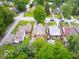 Aerial view of a home and surrounding neighborhood featuring mature trees and manicured lawns at 3558 N Gladstone Ave, Indianapolis, IN 46218
