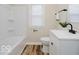 Updated bathroom with new vanity, tub/shower combo, and modern fixtures at 3558 N Gladstone Ave, Indianapolis, IN 46218