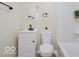 Well-lit bathroom with modern vanity, black faucet, mirror, toilet, and shower at 3558 N Gladstone Ave, Indianapolis, IN 46218