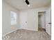 Bright bedroom featuring a ceiling fan, neutral walls, carpet, and a view into another room at 3558 N Gladstone Ave, Indianapolis, IN 46218