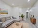 Cozy living room with a comfortable couch, neutral walls, and modern decor at 3558 N Gladstone Ave, Indianapolis, IN 46218