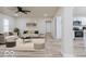 Bright living room featuring modern lighting, stylish decor, and an open layout, seamlessly connects to the kitchen at 3558 N Gladstone Ave, Indianapolis, IN 46218