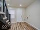 The mud room features access to the backyard, a laundry hookup, and space for storage at 3558 N Gladstone Ave, Indianapolis, IN 46218