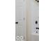 Close-up view of the bright white tiled shower and shower head at 3558 N Gladstone Ave, Indianapolis, IN 46218