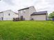 Spacious backyard featuring a wood deck and chain link fence, great for outdoor activities at 3734 Lacebark Dr, Indianapolis, IN 46235