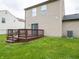 Well-maintained backyard featuring a wooden deck, ideal for outdoor dining and entertaining at 3734 Lacebark Dr, Indianapolis, IN 46235