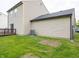 Large backyard with an AC unit and wooden deck, offering space for relaxation and outdoor gatherings at 3734 Lacebark Dr, Indianapolis, IN 46235