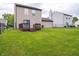 Backyard with deck, lawn, and full perimeter fence at 3734 Lacebark Dr, Indianapolis, IN 46235