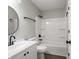 Bathroom with modern sink, bathtub, shower and hardware at 3734 Lacebark Dr, Indianapolis, IN 46235