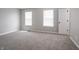 Inviting bedroom featuring neutral colors, carpeted floors, and natural light at 3734 Lacebark Dr, Indianapolis, IN 46235
