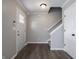 Bright, inviting foyer featuring a staircase, and modern wood flooring at 3734 Lacebark Dr, Indianapolis, IN 46235