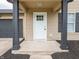 Front porch featuring mulch landscaping, and dark columns that frame the doorway at 3734 Lacebark Dr, Indianapolis, IN 46235