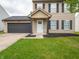 Beautiful home featuring a well-maintained lawn and welcoming facade at 3734 Lacebark Dr, Indianapolis, IN 46235