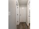Hallway with hardwood floors and leading to bathroom and entrance at 3734 Lacebark Dr, Indianapolis, IN 46235