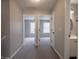 Hallway featuring carpeted floors and doorways to bedrooms and a bathroom at 3734 Lacebark Dr, Indianapolis, IN 46235