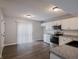 Bright kitchen with white cabinetry, stainless steel appliances, and new hardwood floors at 3734 Lacebark Dr, Indianapolis, IN 46235