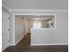 Open-concept living room showcasing view into kitchen, gray walls, and hardwood floors at 3734 Lacebark Dr, Indianapolis, IN 46235