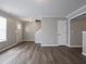 Spacious living room featuring wood floors, neutral walls, and an inviting entryway at 3734 Lacebark Dr, Indianapolis, IN 46235
