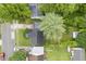 Aerial view of home with a cozy backyard, lush lawn, and mature trees at 400 E 34Th St, Anderson, IN 46013
