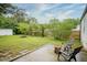 Backyard with a firepit surrounded by greenery and outdoor seating at 400 E 34Th St, Anderson, IN 46013