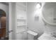 Bright bathroom featuring a toilet, sink, and storage cabinet at 400 E 34Th St, Anderson, IN 46013