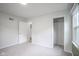 Bedroom with gray walls, closet, one window, and plush carpet at 400 E 34Th St, Anderson, IN 46013