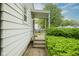 Inviting entryway with steps leading up to a covered porch and front door at 400 E 34Th St, Anderson, IN 46013