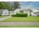 Charming home featuring a well-manicured front lawn and inviting curb appeal at 400 E 34Th St, Anderson, IN 46013