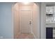 Open hallway showcasing marble flooring and entryway into the kitchen at 400 E 34Th St, Anderson, IN 46013