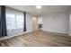 Well-lit living room shows hardwood floors, light walls, and large picture window at 400 E 34Th St, Anderson, IN 46013
