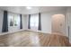 Bright living room with hardwood floors, large windows, and neutral paint at 400 E 34Th St, Anderson, IN 46013