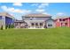 Expansive backyard with lush lawn, patio, outdoor dining, and gazebo for relaxed outdoor living and entertaining at 4163 Ironclad Dr, Bargersville, IN 46106
