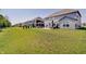 Wide backyard view with multiple homes and a patio featuring a gazebo and dining area for outdoor enjoyment at 4163 Ironclad Dr, Bargersville, IN 46106