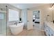 Spa-like bathroom featuring a soaking tub, a walk-in shower, and bright modern fixtures at 4163 Ironclad Dr, Bargersville, IN 46106