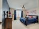 This themed bedroom features a custom paint job, a large bed, and modern lighting for a creative space at 4163 Ironclad Dr, Bargersville, IN 46106