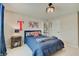 This fun themed bedroom has a large bed, comfortable bedding, and side table for restful nights at 4163 Ironclad Dr, Bargersville, IN 46106