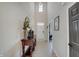 Inviting entryway with high ceilings, stylish console table, decorative accessories, and wood-look flooring at 4163 Ironclad Dr, Bargersville, IN 46106