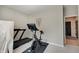 Cozy exercise room features a treadmill, stationary bike, and neutral tones, creating an ideal fitness space at 4163 Ironclad Dr, Bargersville, IN 46106