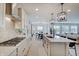 Open concept kitchen with granite countertops, stainless steel appliances, and view to dining and living area at 4163 Ironclad Dr, Bargersville, IN 46106