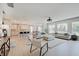 Open floor plan with modern furnishings, seamlessly connecting the living room, dining area, and kitchen at 4163 Ironclad Dr, Bargersville, IN 46106