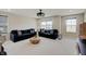 Bright living room with large windows, plush couches, and a wooden center table at 4163 Ironclad Dr, Bargersville, IN 46106