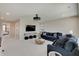 Open-concept living room with comfortable seating, TV, and neutral color scheme at 4163 Ironclad Dr, Bargersville, IN 46106