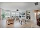 Bright living room features a fireplace with marble surround, modern furniture, and ample natural light at 4163 Ironclad Dr, Bargersville, IN 46106