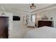 Inviting main bedroom with a dresser, tv, and comfortable seating area at 4163 Ironclad Dr, Bargersville, IN 46106