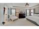 Elegant main bedroom featuring tray ceilings, neutral tones, and ample natural light at 4163 Ironclad Dr, Bargersville, IN 46106
