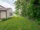 Expansive backyard featuring well-maintained lawn and lovely landscaping at 4382 Castlebay Way, Indianapolis, IN 46254